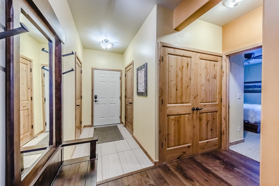 View of the Entry - View of the front door (white).  The door to the left is a large walk-in closet available for guest use.
