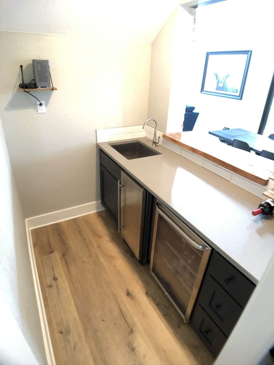 Wet-bar with large ice-maker machine and mini-fridge for your cold beverages.