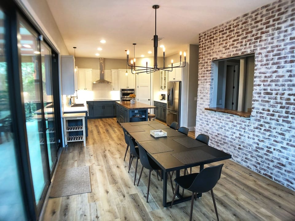 8-chair dining table adjacent to wet-bar