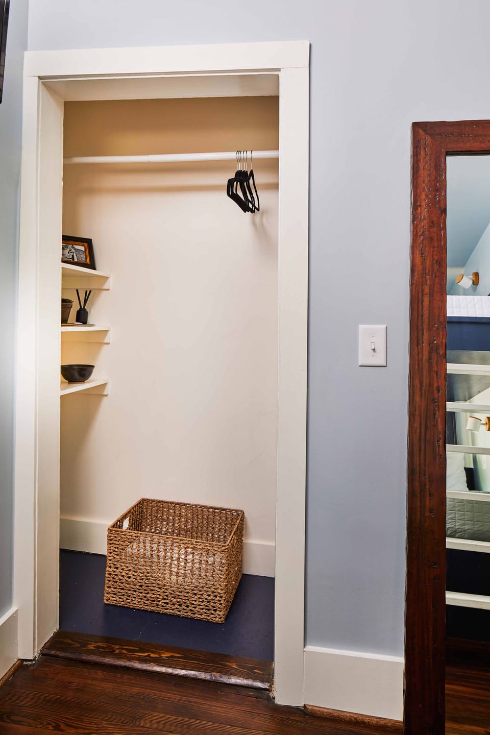 The closet includes places to hang and fold clothes.