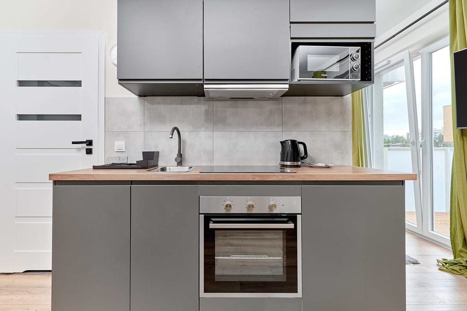 The kitchenette's practical layout maximizes space and functionality.