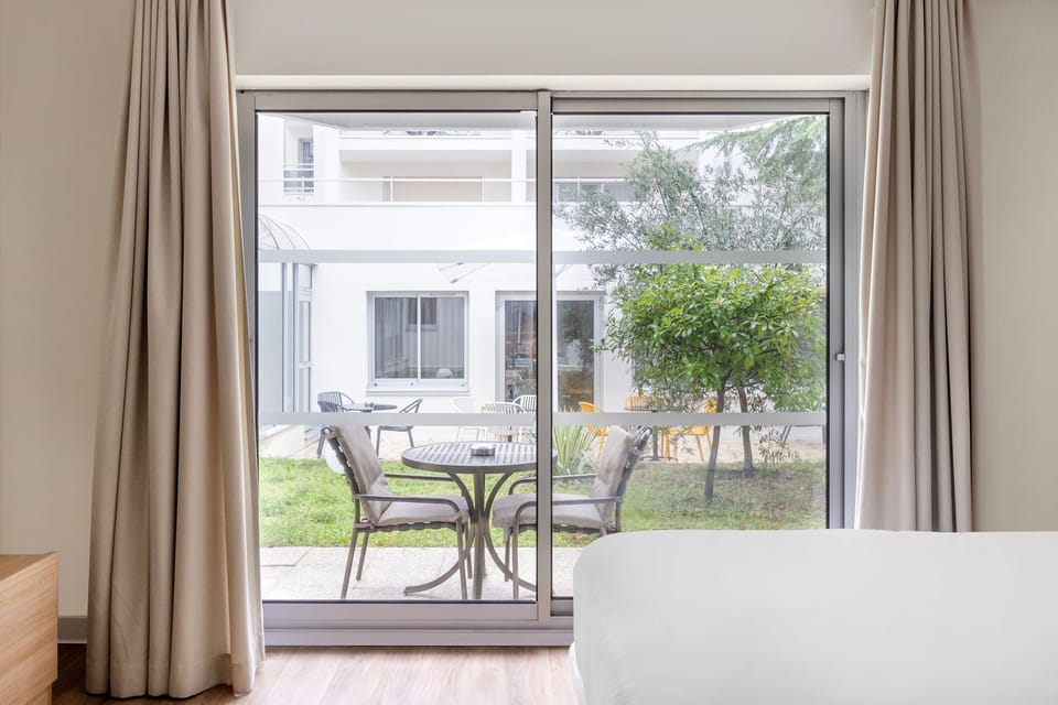 Enjoy a serene view from your private balcony, perfect for sipping coffee and unwinding.