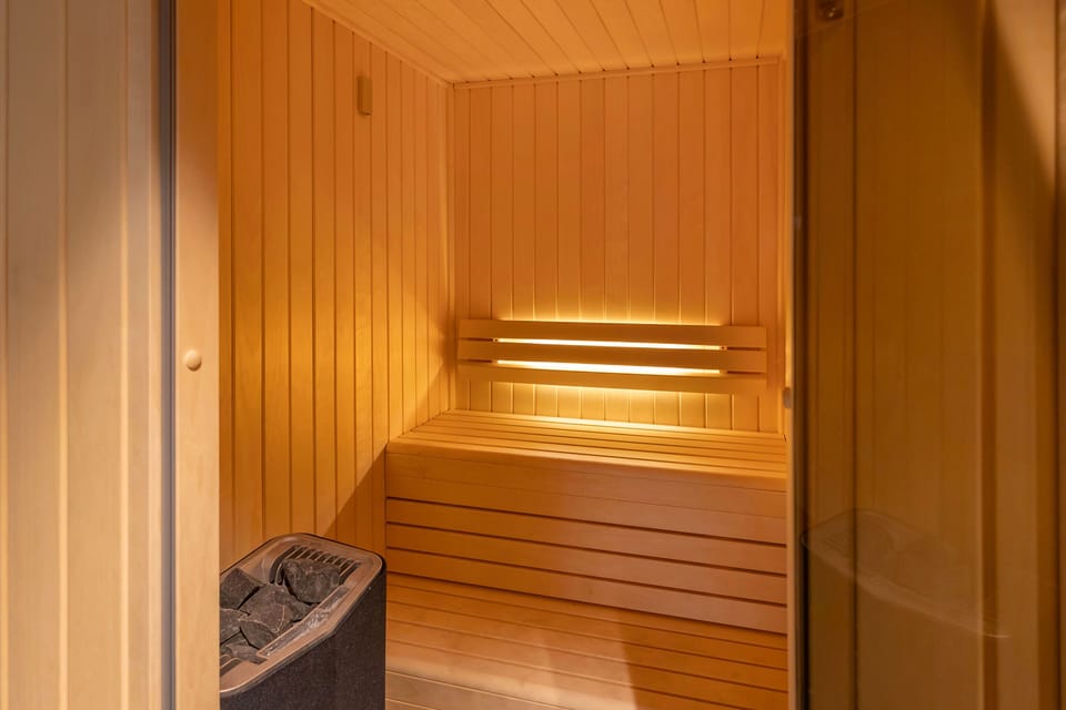 Relax and unwind in the sauna, offering a tranquil space for rejuvenation after a busy day.