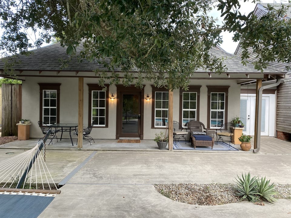 Back entrance to Little Crawfish suite overlooking pool and Bayou