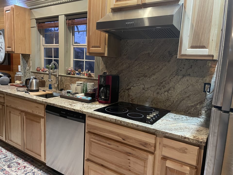 dishwasher, garbage disposal, stove top, full size refrigerator with icemaker