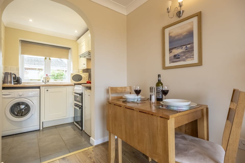Ground floor: Dining area with kitchen beyond