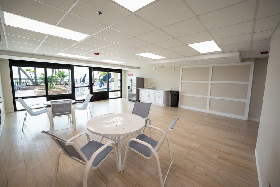 Carlos Pointe Indoor Dining Area with Kitchen overlooking the Pool