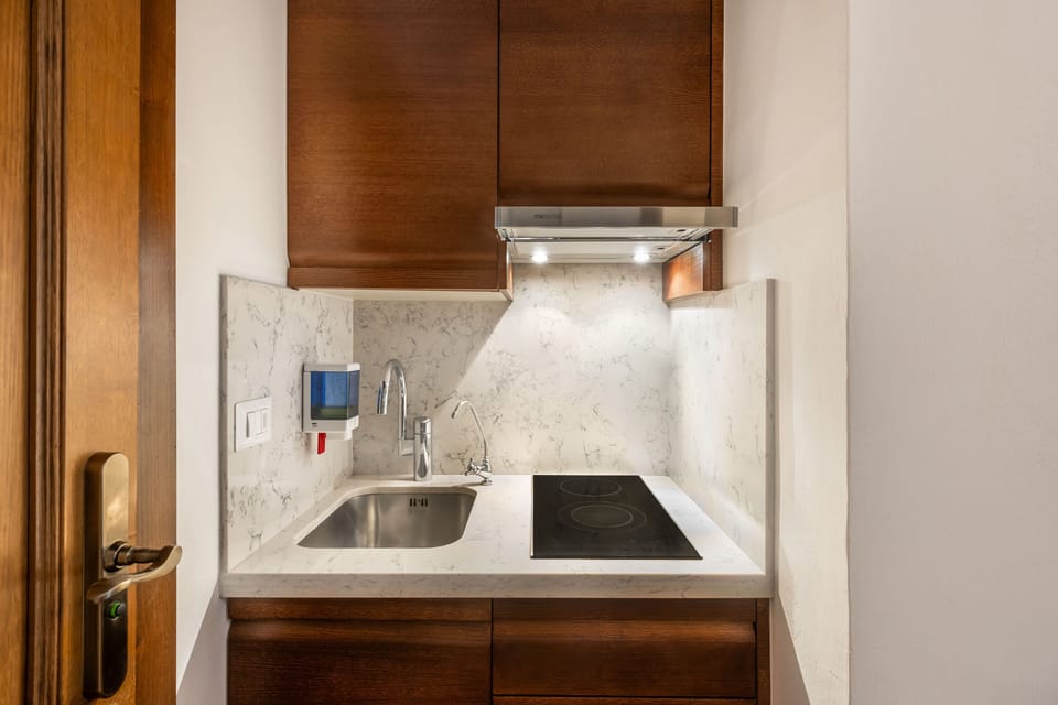Enjoy the convenience of a compact marble kitchen designed for effortless daily living.