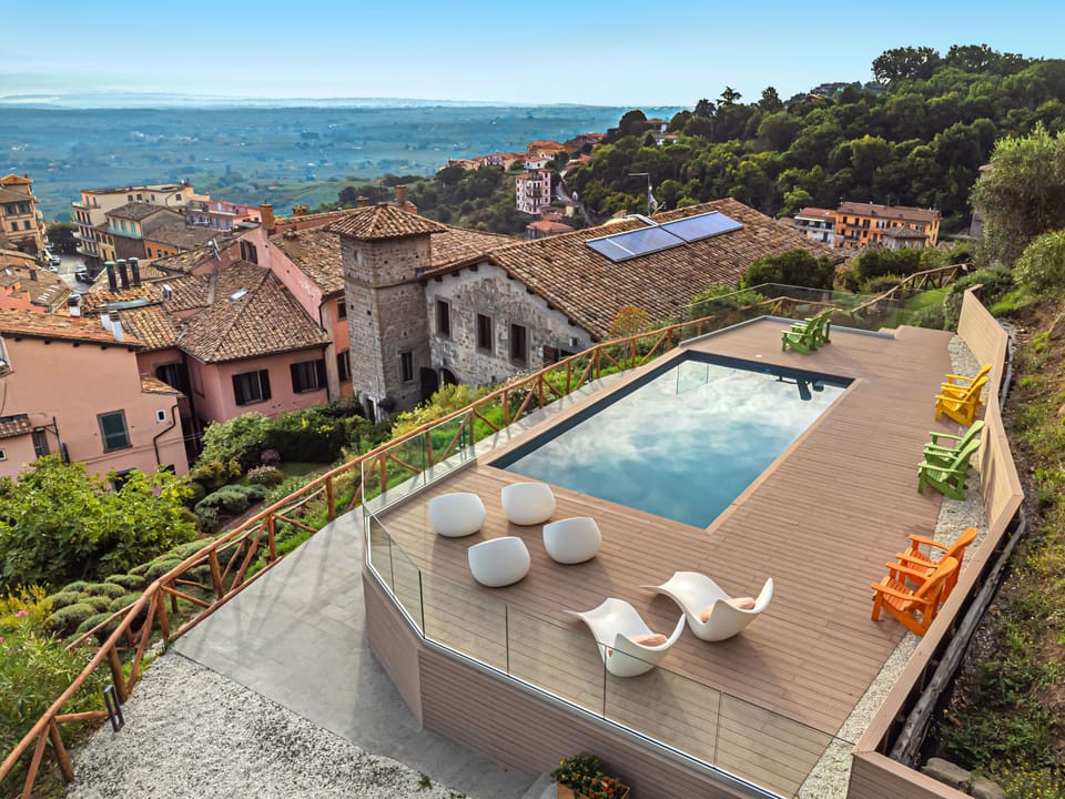 A rooftop  pool, overlooking the vibrant tapestry of the city, perfect for serene afternoons.