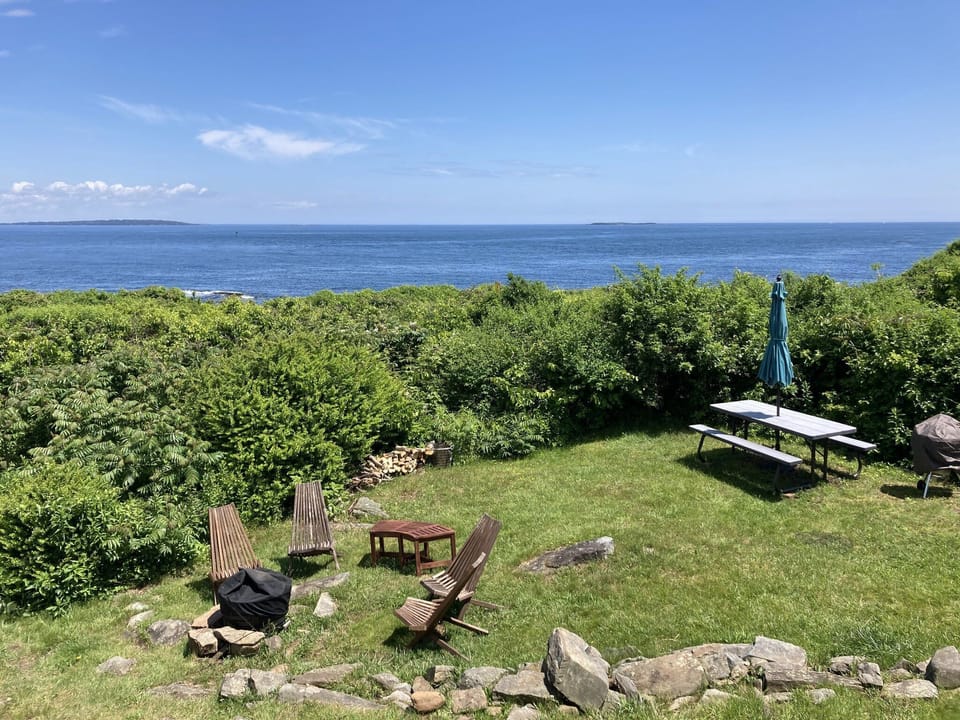 Secluded front yard with ocean views, seabreezes, firepit, Charcoal grill.