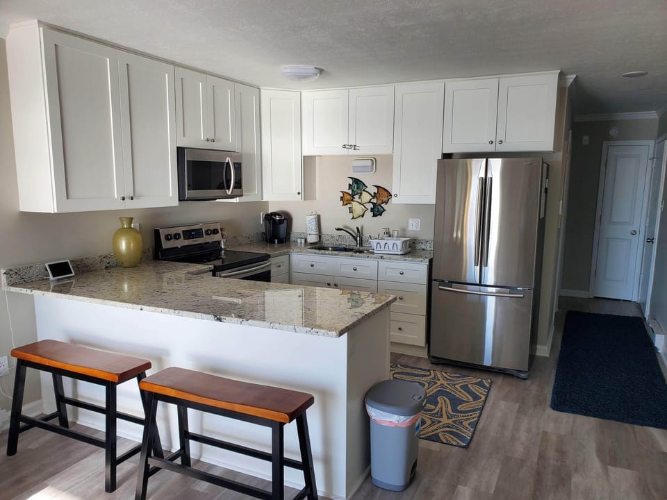 Premier upgraded kitchen with granite, stainless appliances and soft close cabinets