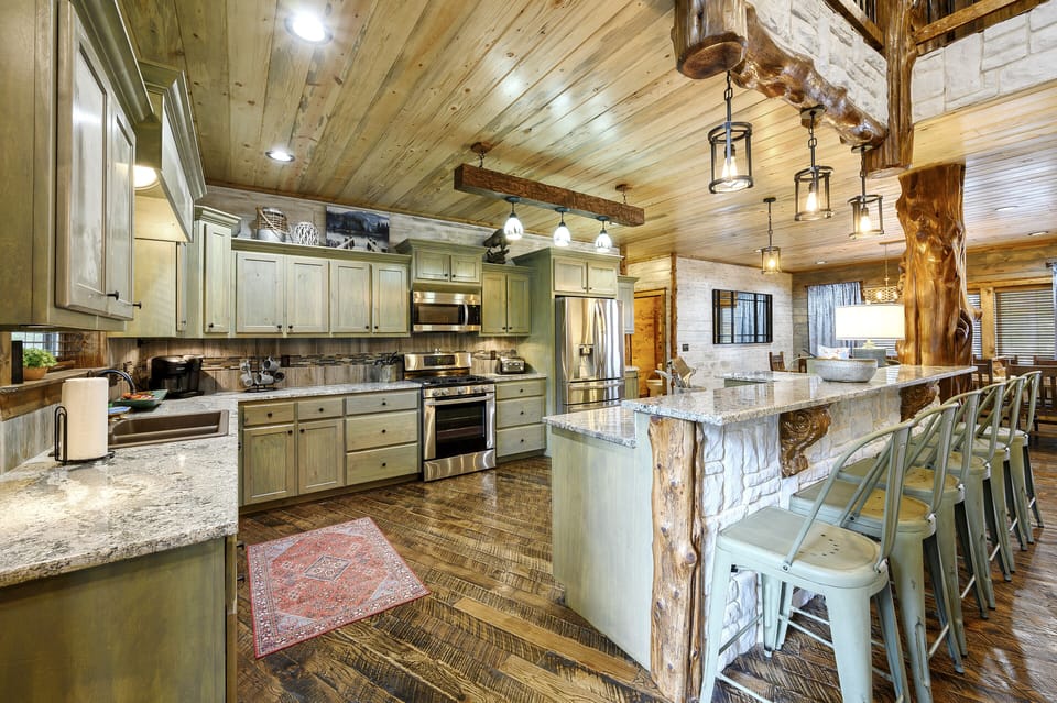 Every culinary enthusiast's dream kitchen + extra seating with 8 at the bartop! 