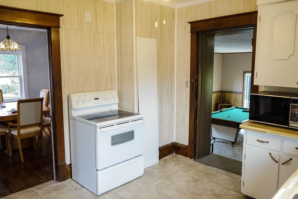 oven and stove,  doors to dining and games room