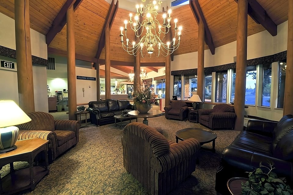 Unwind beneath the grand chandelier in a cozy lounge.