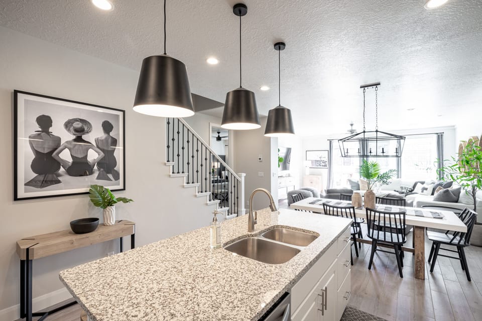 Kitchen View - The kitchen is fully stocked with all the dishes, cookware, baking pans, and cutlery you will need for meal preparations and includes stainless steel appliances and granite counter tops.