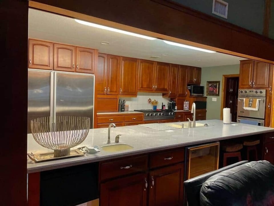 Island features double sink with dish washer, ice maker and wine cooler