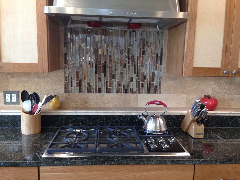 Wolf Gas Cooktop & Granite counter tops. Ocean views on left!