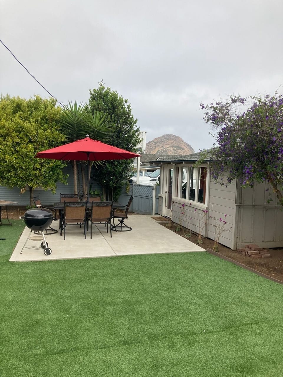 Private backyard with charcoal BBQ and beautiful views of Morro Rock.