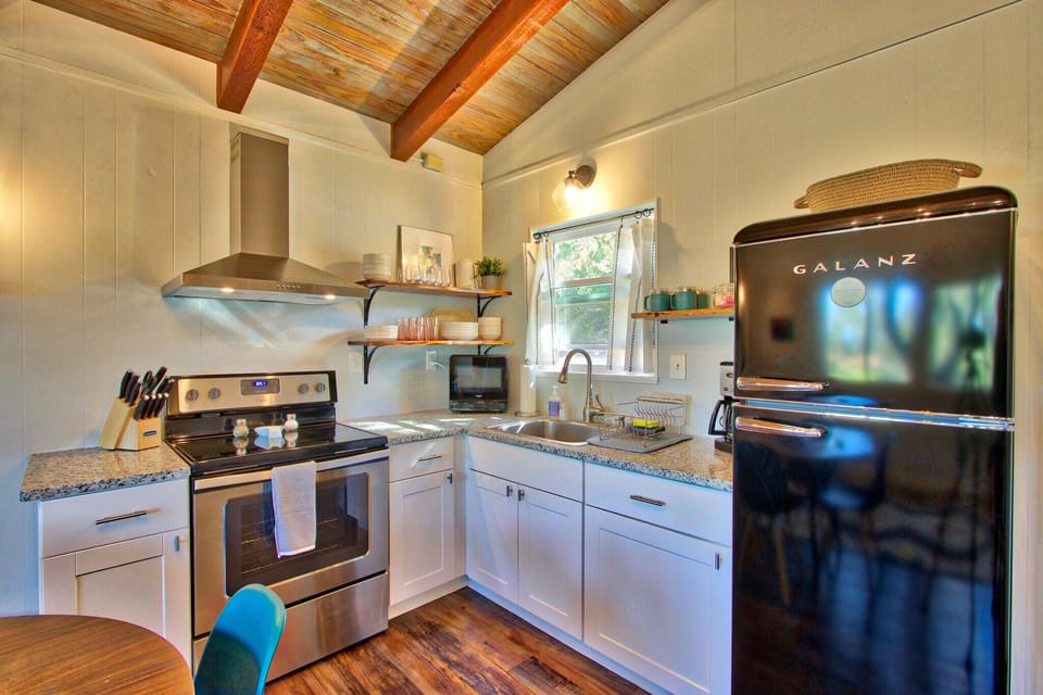 Close up of modern kitchen. Stove, oven, refrigerator in the picture.