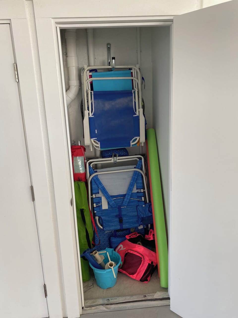 Garage level storage with beach chairs/umbrellas for you to use during your stay