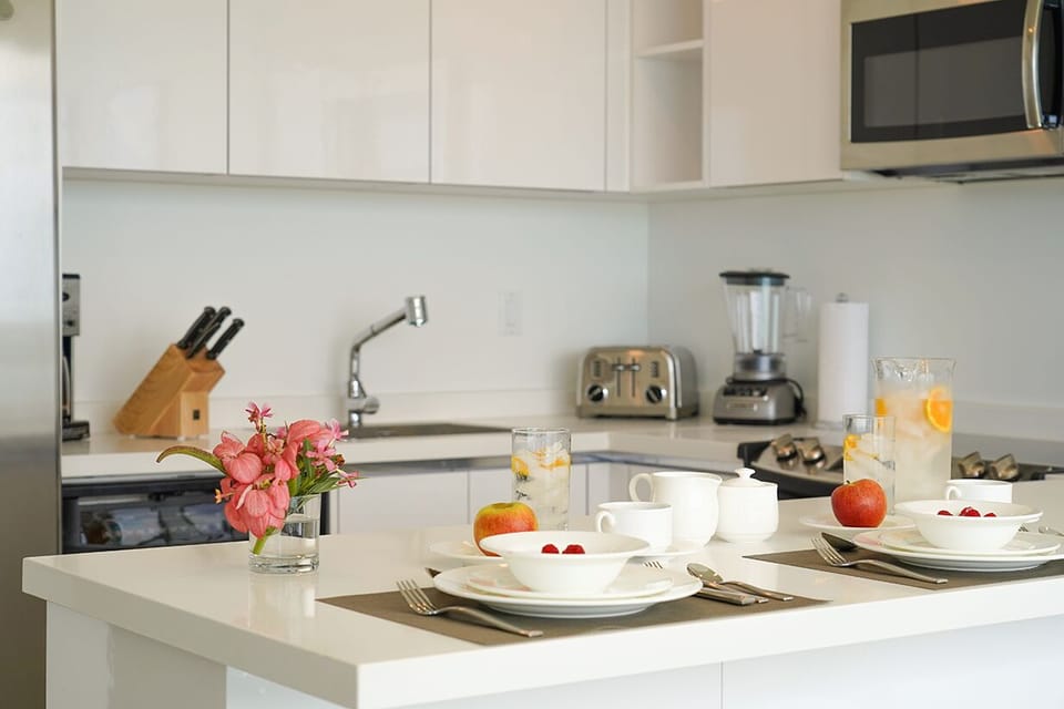 Step into your bright, modern kitchen, fully equipped for leisurely breakfasts with sleek appliances, ample counter space, and everything you need to feel at home.