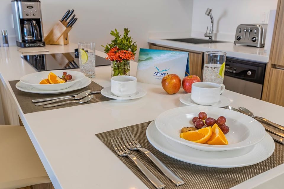 Wake up to fresh fruit and coffee in your fully equipped kitchen, perfect for preparing light meals or enjoying breakfast at the counter before exploring the area.