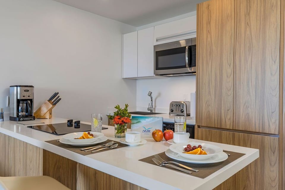 Your modern kitchen is fully equipped with sleek appliances, perfect for preparing fresh meals during your stay. Enjoy breakfast at the counter and savor each moment in your home away from home.