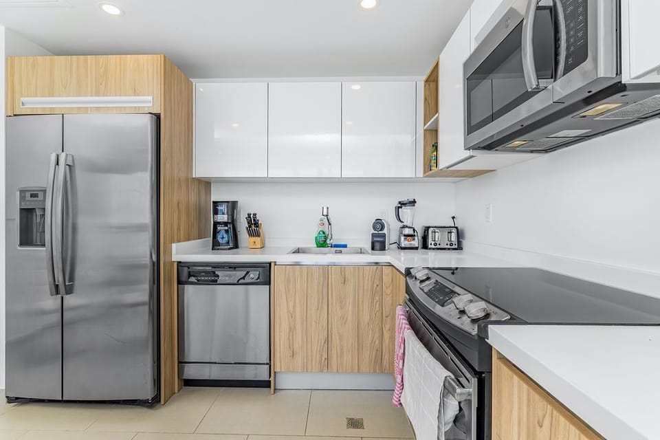 Your modern kitchen has everything you need: full-size appliances, ample counter space, and quality cookware. Prepare meals with ease, whether it's morning coffee or a full dinner.