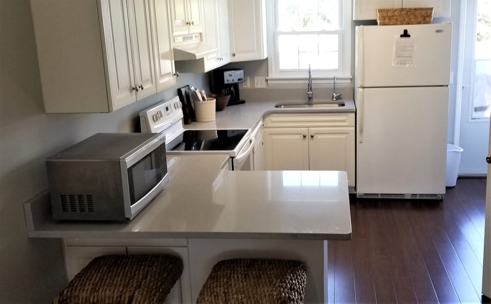 Fully equipped kitchen with quartz counters