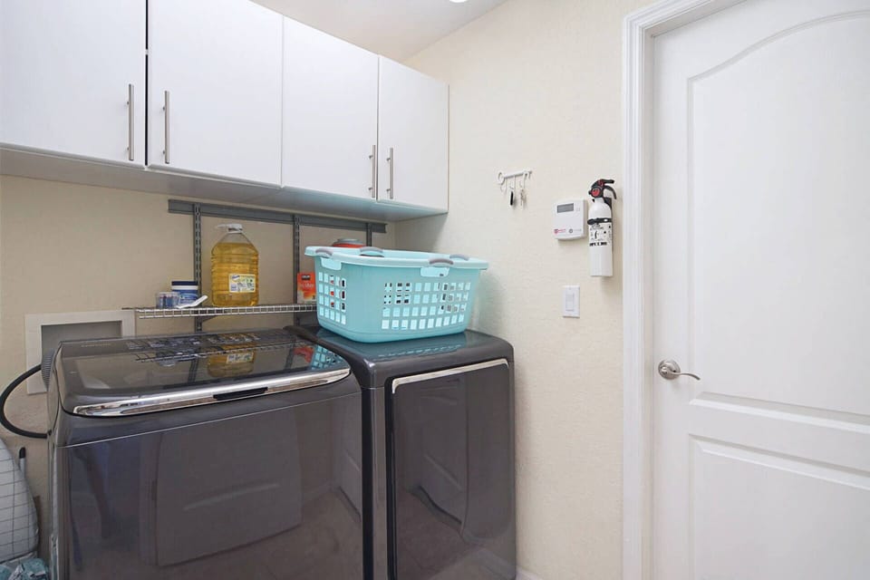 The laundry room is located inside the home, making it convenient for laundry