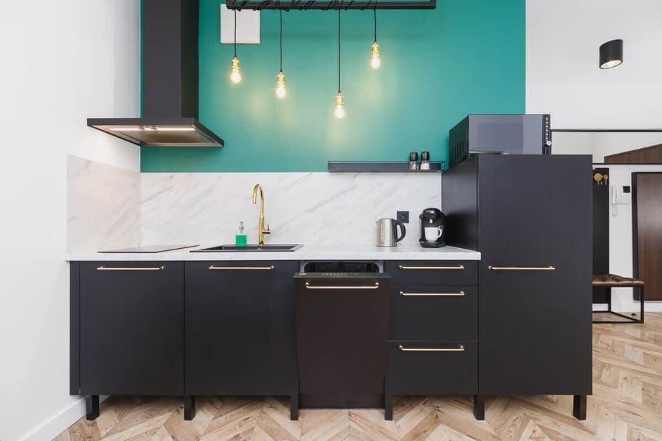 Kitchenette with dishwasher and refrigerator. 