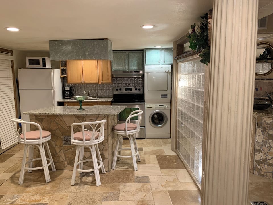 complete kitchen and utensils, and for your convenience, Bosch washer and dryer