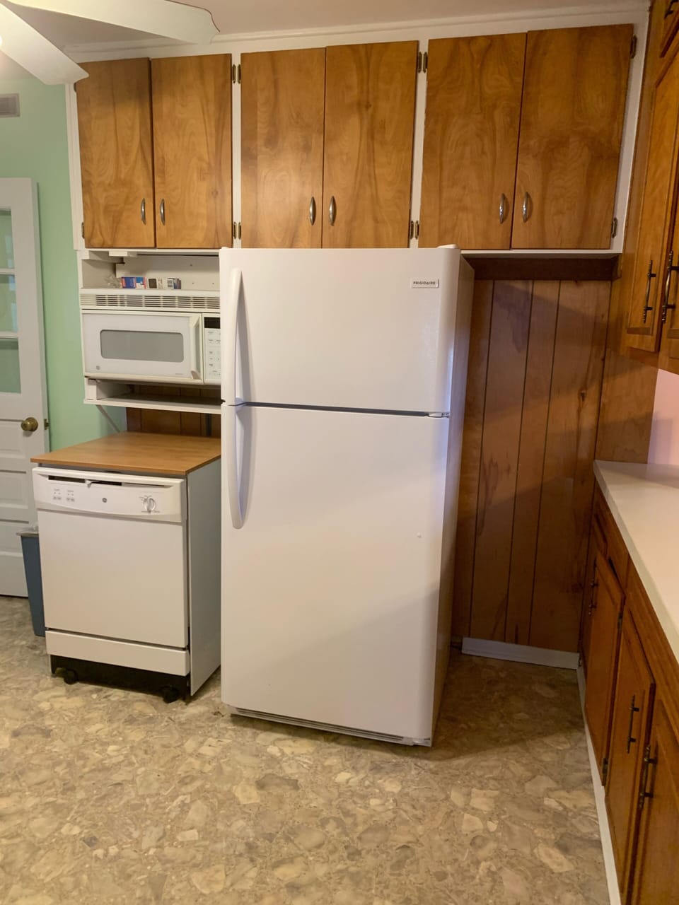 Refrigerator with ice maker, portable dishwasher and microwave 