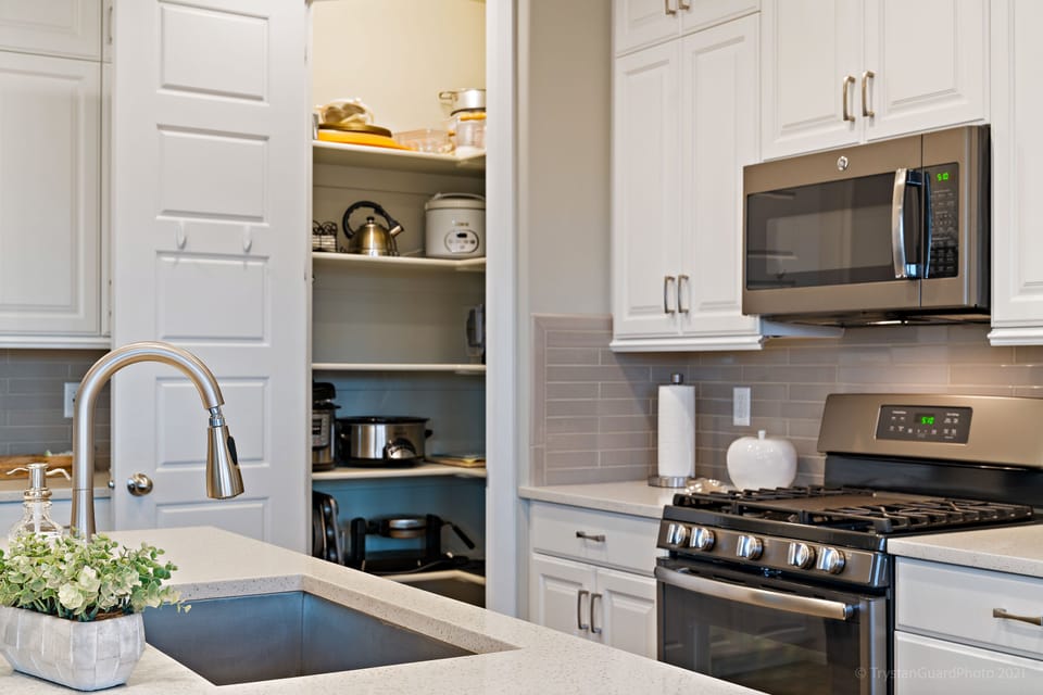 Fully stocked gourmet kitchen featuring all the comforts of home and extra seating at the bar