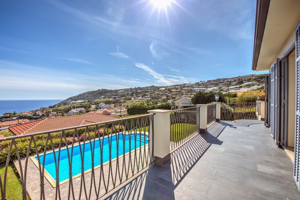 Terrace with view on pool and sea