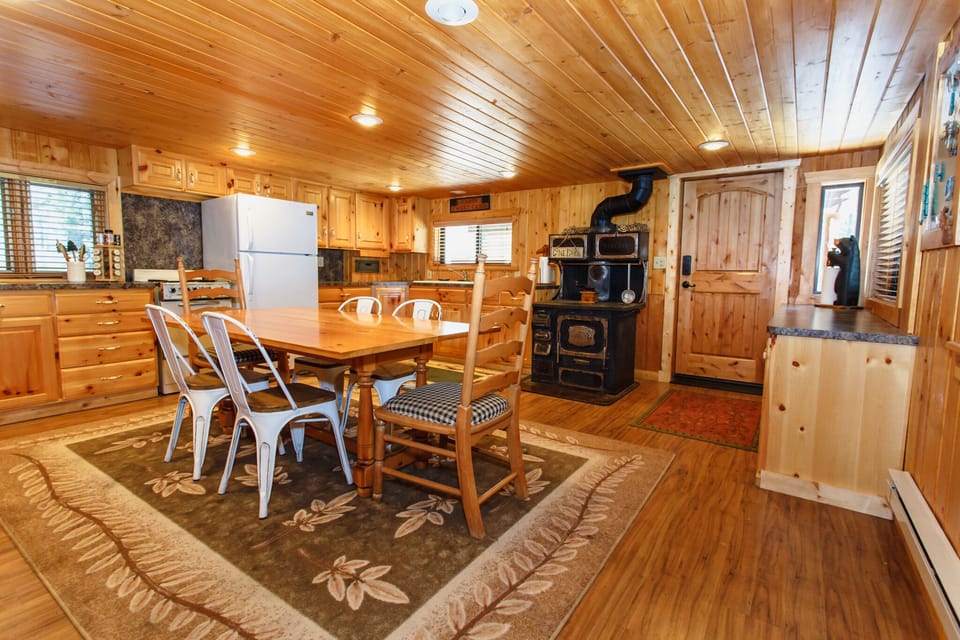 Main cabin kitchen, seating for 8. Extra dining on front porch.