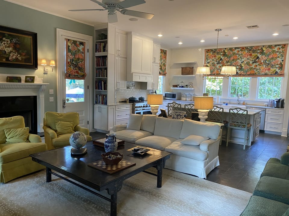 Den space and adjoining open kitchen