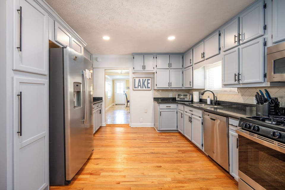 Bright kitchen w/ stainless appliances, toaster oven and coffee maker