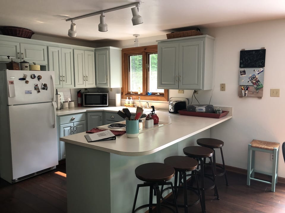 Enjoy the light and well stocked kitchen.