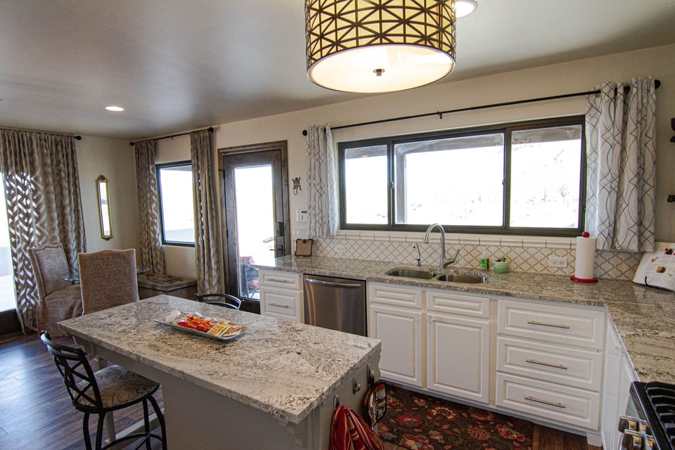 natural light with multiple dining areas including island and outdoor seating 