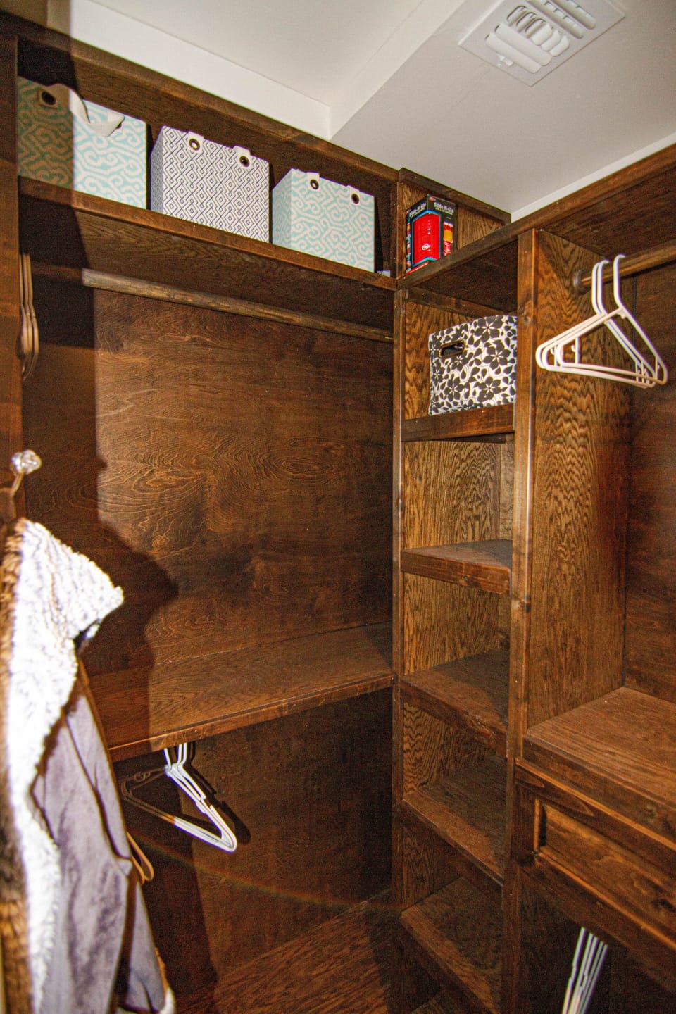 5 hanging spaces, full mirror, and iron and ironing board in the master closet