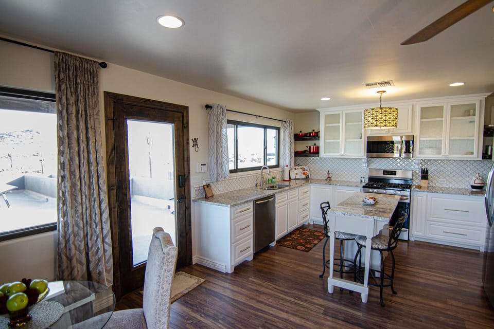 Views from all dining areas, full size kitchen, custom doors, all hard floors 