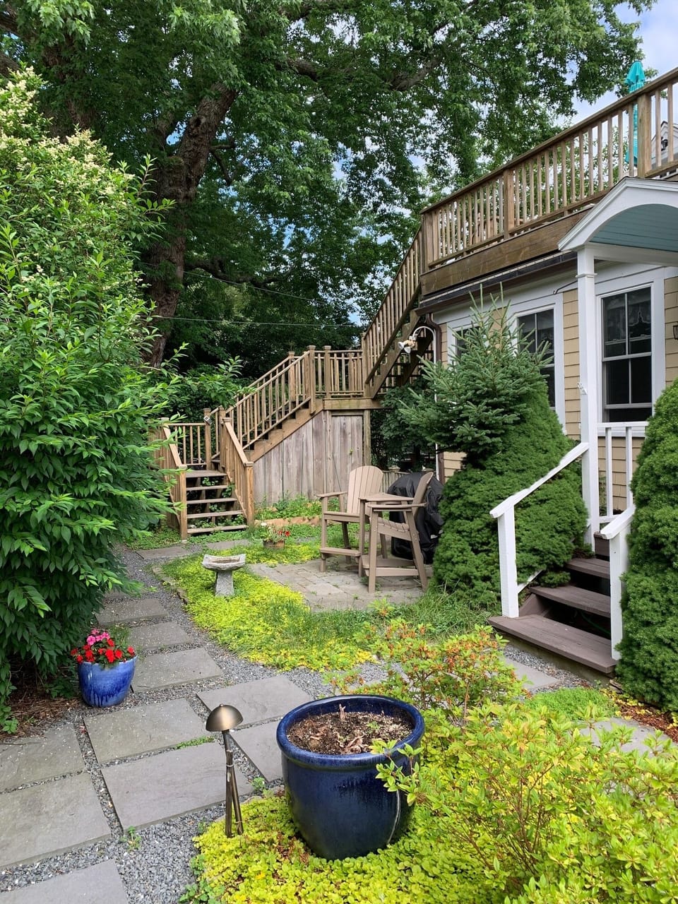 Gardens and stairs to unit.