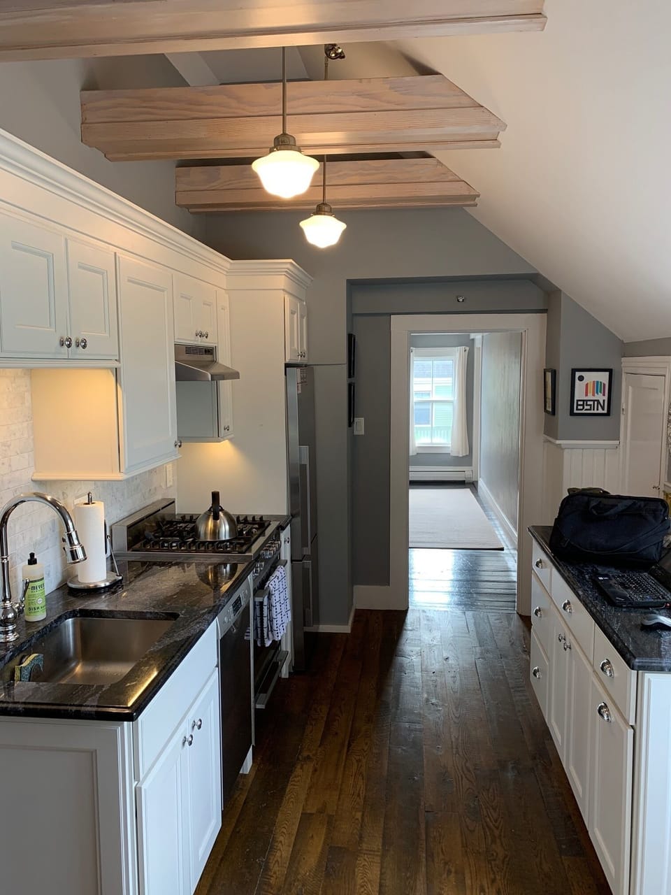 Kitchen and hallway with bedrooms.