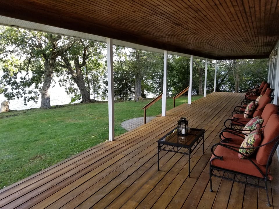 Lots of comfortable seating on the huge 50-foot verandah overlooking the water.