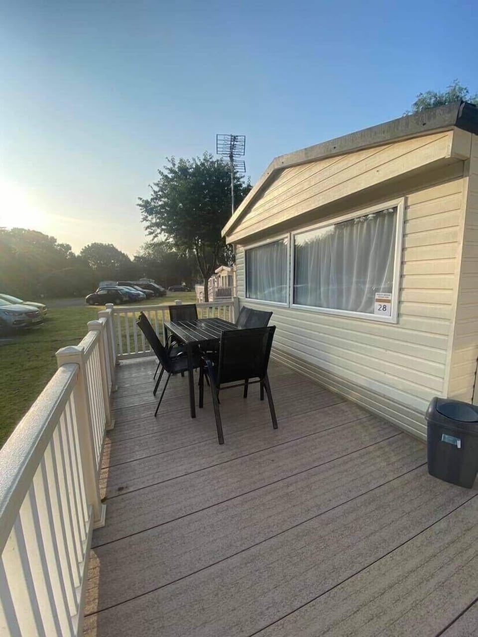 Outside wrap round veranda with dining table and chairs 