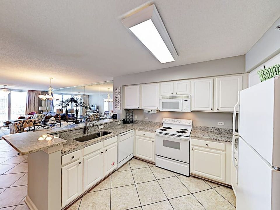 Open kitchen with gleaming new counter tops ready for gourmet!
