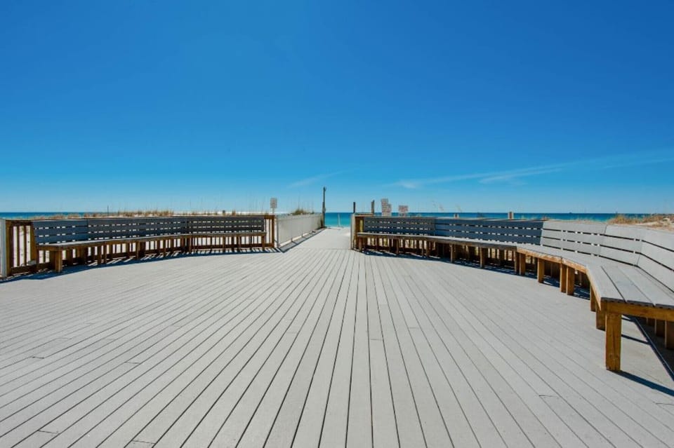 Boardwalk and rinse showers on the way to the private Pelican Beach
