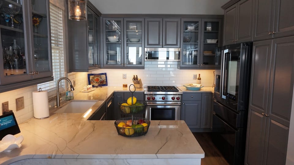 Kitchen with stocked pantry, dishwasher, smart refrigerator and Wolf stove.