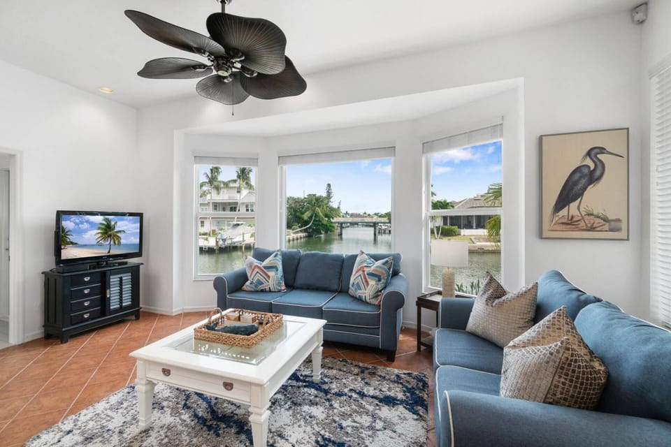 Relax and enjoy the sunshine and converging waterway views, whether inside or out!